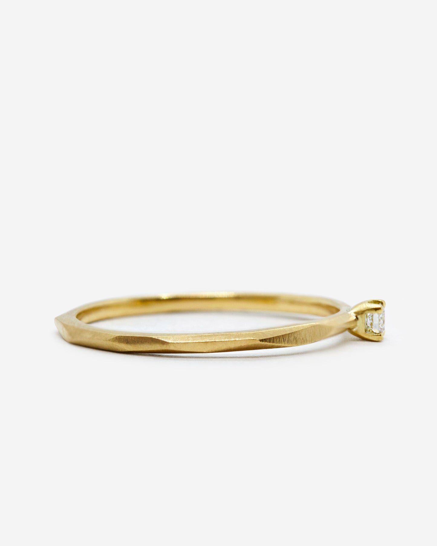 18k fairmined gold fine Rock ring with a small white diamond